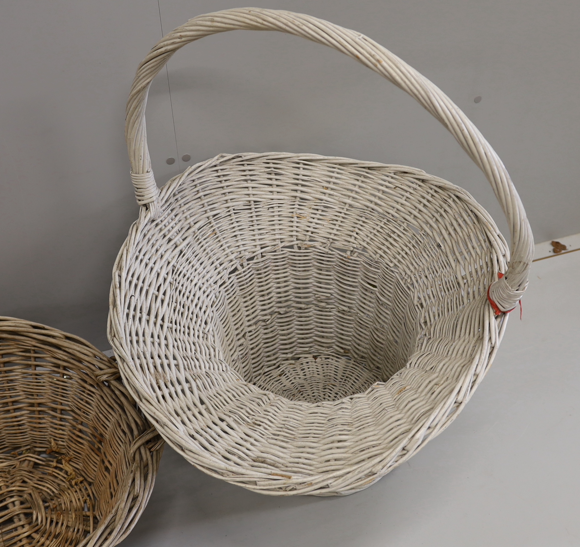 Two large wicker baskets, larger height 86cm